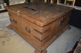 A large pine coffee table/storage box.