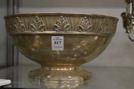 A silver pedestal bowl with embossed rim and foot rim.