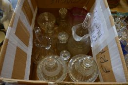 A pair of cut glass pedestal jars and covers, cut glass jugs and other items.