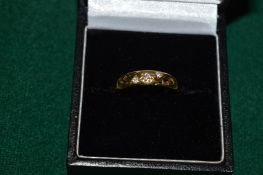 An 18ct gold and diamond ring.
