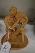 An Eastern terracotta model of a musician.