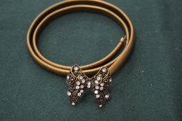 A belt with butterfly clasp.