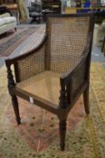 A 19th century child's bergere armchair.