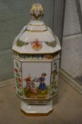 A Continental porcelain vase and cover painted with panels of flowers and Oriental figure subjects.