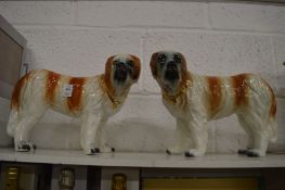 A large pair of Staffordshire models of St Bernards.