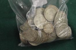 A large quantity of pre-decimal shillings.