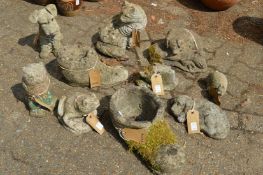 A collection of reconstituted stone garden ornaments modelled as animals etc.