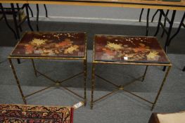 A stylish set of three brass and lacquer occasional table with glass tops decorated in a chinoiserie