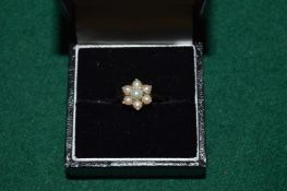 A 9ct gold and pearl cluster ring.