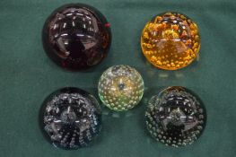 A group of four Whitefriars paperweights and one other.