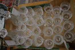 A suite of Tudor glassware comprising twelve red wine, twelve white wine and pair of decanters.