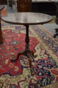 A 19th century mahogany circular tilt-top tripod table.