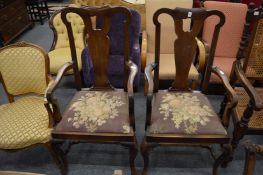 A pair of George III style mahogany open armchairs with drop-in seats.