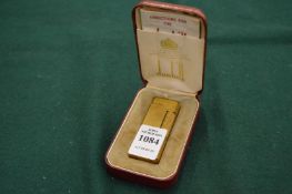 A boxed Dunhill lighter with instructions.