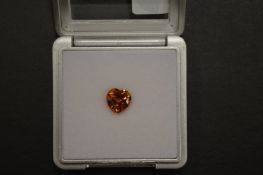A heart shaped citrine, boxed with certificate.