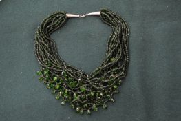 A green bead necklace.