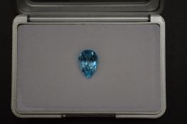 A pear shaped blue topaz, boxed with certificate.