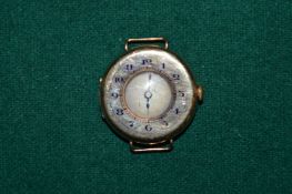 A 1930's 9ct gold and enamel half hunter wristwatch.