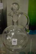 A Victorian clear glass decanter and stopper.