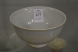 A small Chinese pottery bowl.