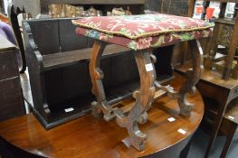 An oak stool and wall shelf.