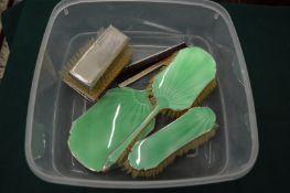 Silver and enamel three piece dressing table set, pair of silver backed brushes and similar combs.
