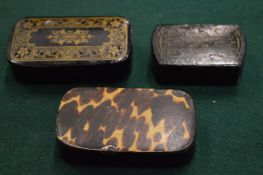 Papier mache and tortoiseshell snuff boxes.