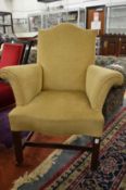 A small Georgian style wing armchair.