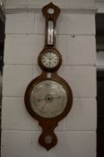 A combination mahogany cased barometer, thermometer and clock.