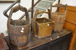 Three old Chinese grain buckets.