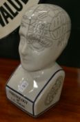 A reproduction phrenology head.