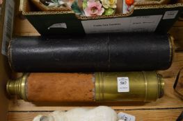 A brass and leather telescope with leather storage case.