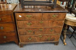 An 18th century walnut chest of two short and three graduated long drawers on bracket.