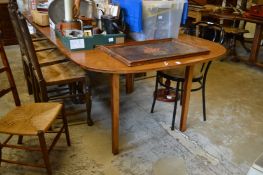 A mahogany D end dining table with one extra leaf.
