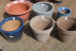 Six various plant pots.