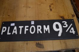 A novelty carved wood and painted sign 'Platform 9¾'.