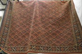 Persian carpet, red ground with stylised decoration, 285cm x 215cm.