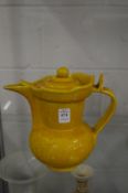 A yellow glazed Chinese lidded ewer.