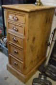 A pine five drawer pedestal chest.