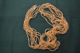 A crystal necklace set with pearls.