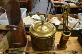 A brass coal box, copper coal scuttle and brass fireside tools.