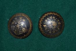 A pair of tortoise and gold ear clips.