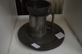 A pair of 18th century pewter plates by John Home of London together with a pewter wine funnel and