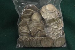 A large quantity of pre-decimal shillings and other coins.