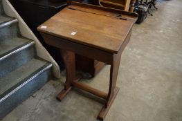 An old oak and pine school desk.