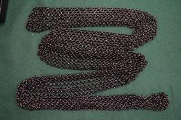 A Ralph Lauren chain link belt, boxed.