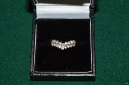 A 14ct gold bow shaped dress ring.