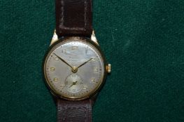A gentlemans Baume 9ct gold automatic wristwatch.