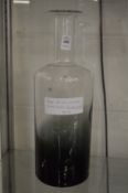 A large glass bottle vase, possibly by Holmegaard.