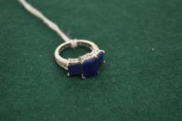 14ct white gold, diamond and sapphire ring.